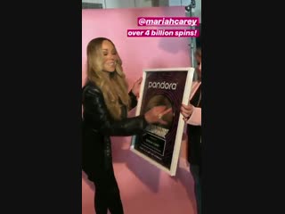 mariahcarey receives plaque at pandora music for achieving over 4 billion spins on